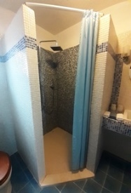 a bathroom with walk-in shower